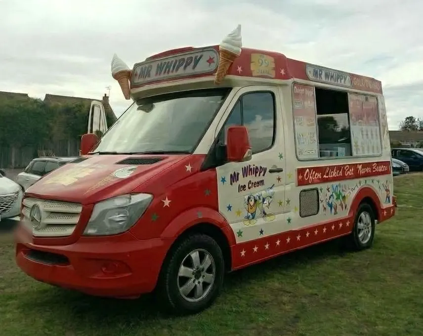 The Whippy on Wheels ice cream van, red and cream with cones on the roof